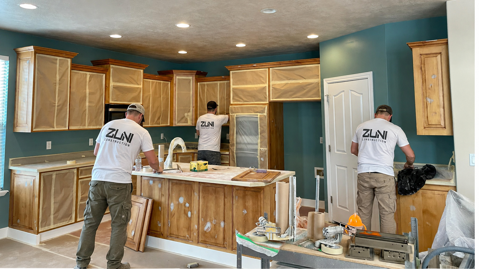Zuni Construction painting crew on a job site in Provo